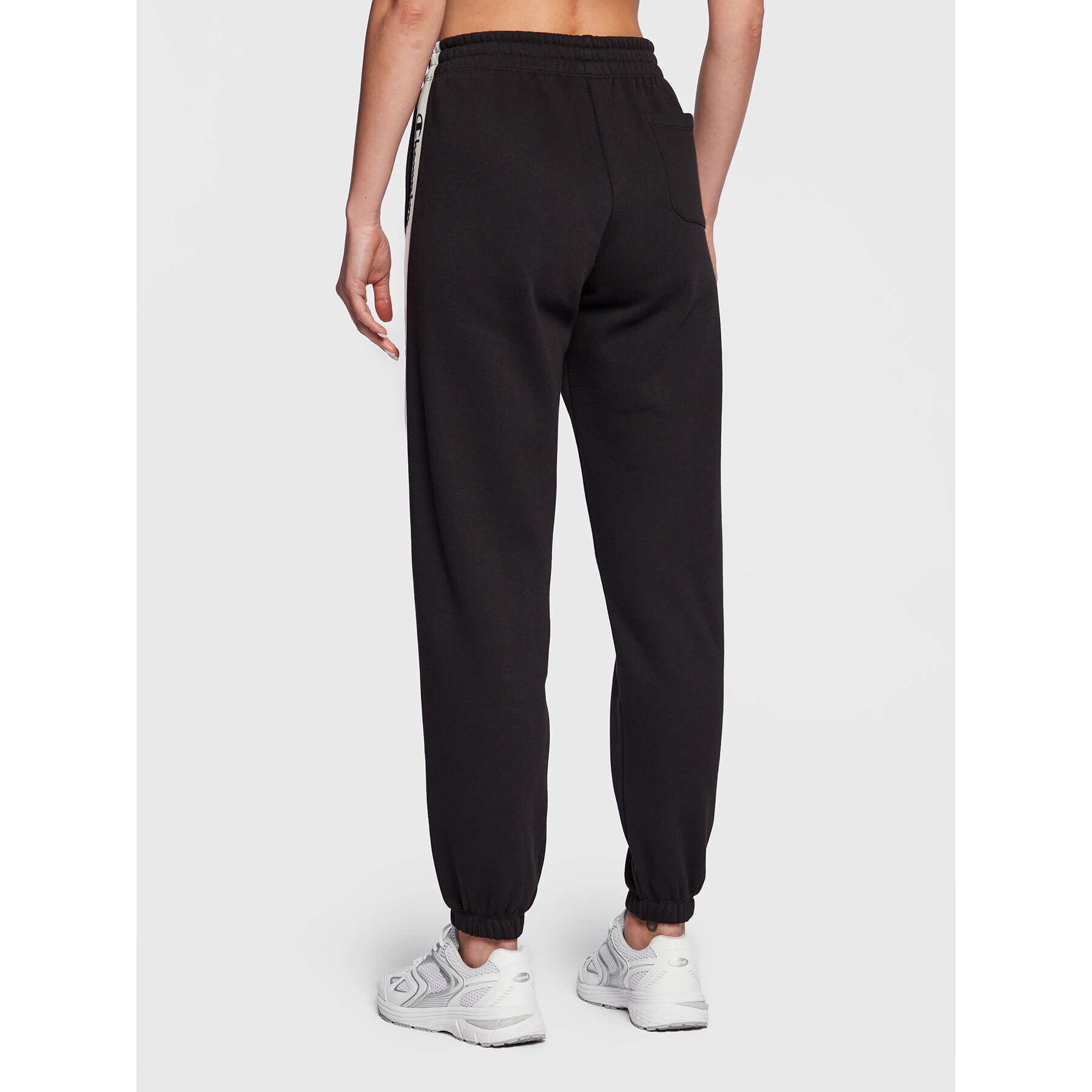 Champion Долнище анцуг Slide Tape 115576 Черен Regular Fit - Pepit.bg