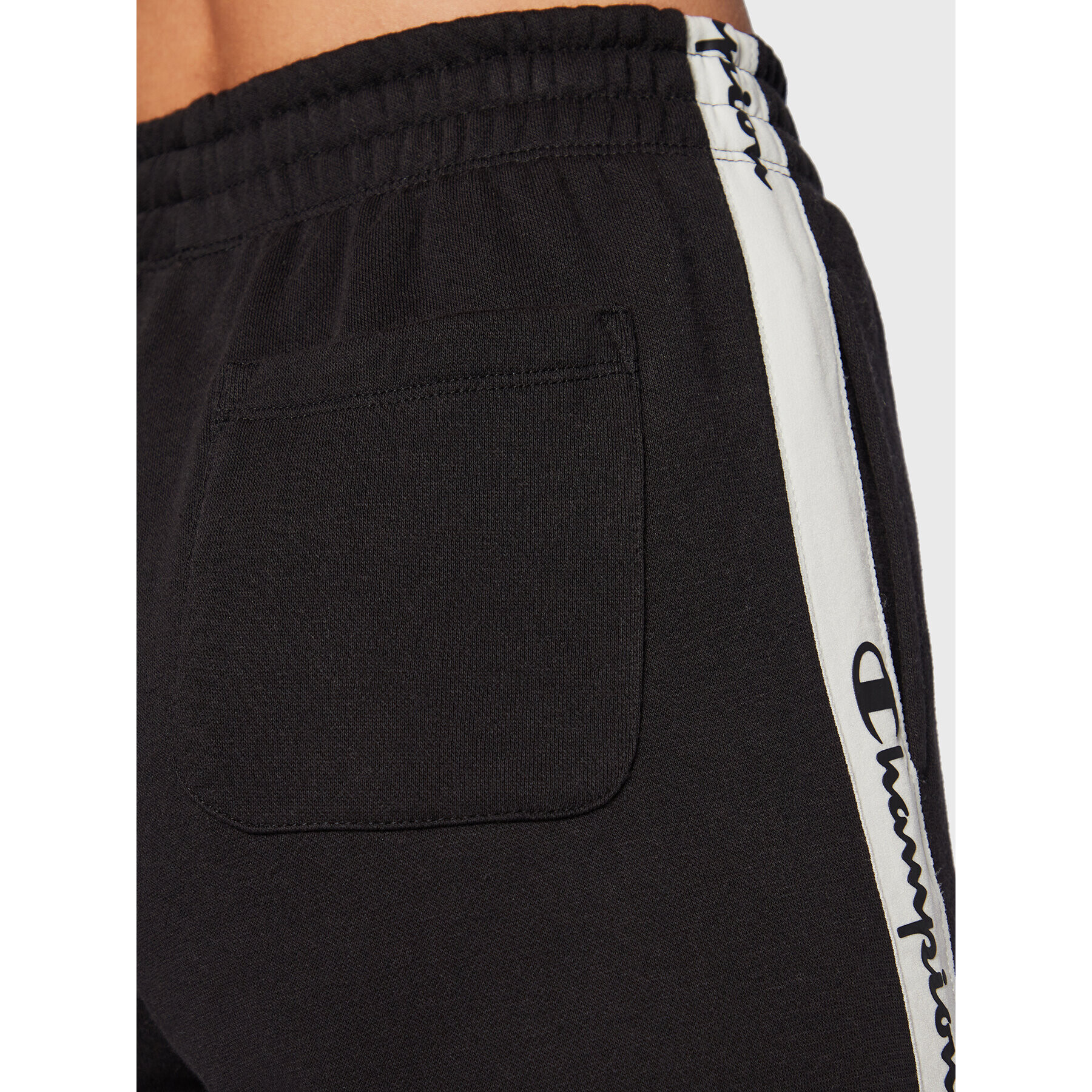Champion Долнище анцуг Slide Tape 115576 Черен Regular Fit - Pepit.bg