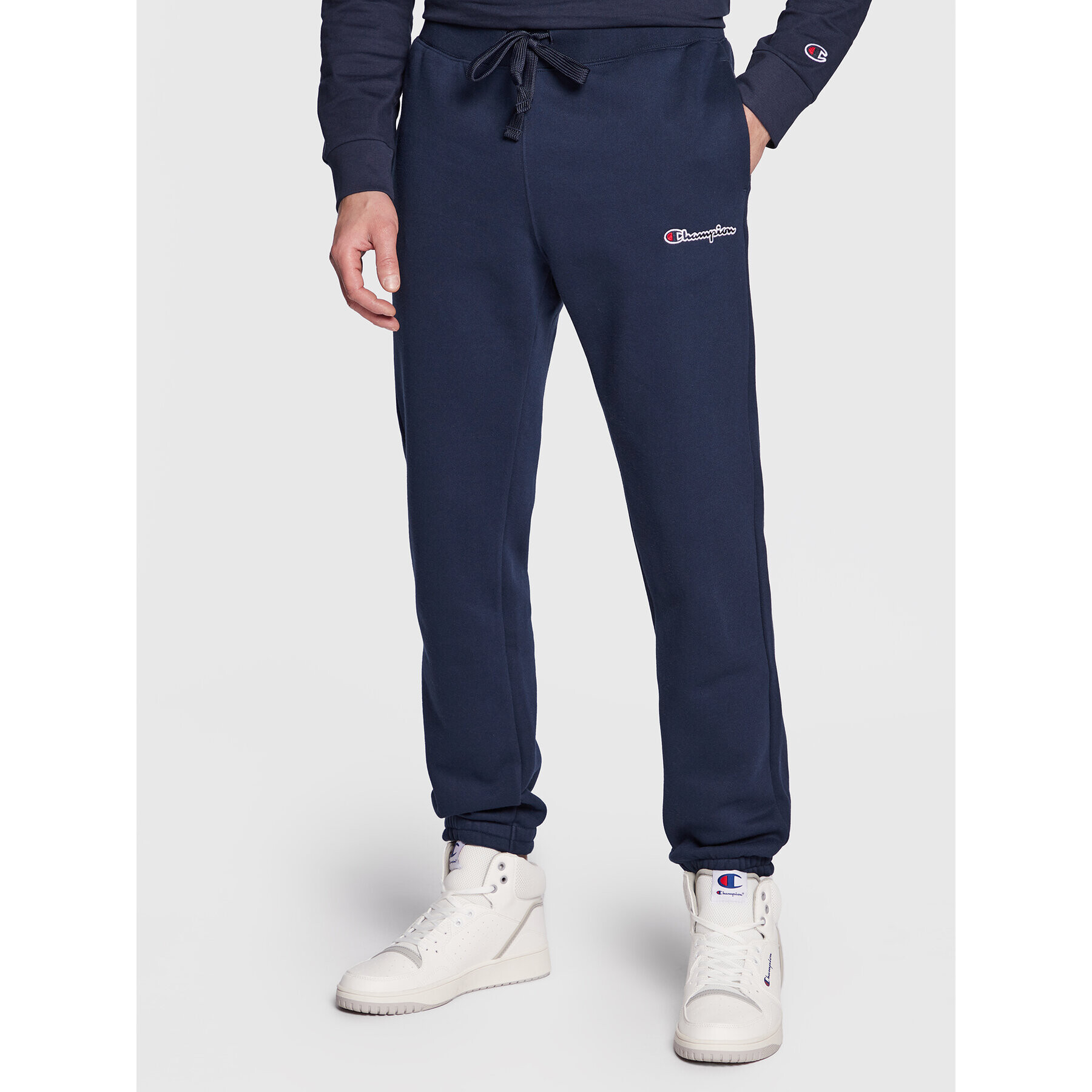 Champion Долнище анцуг Small Embroidery Script 218294 Тъмносин Regular Fit - Pepit.bg