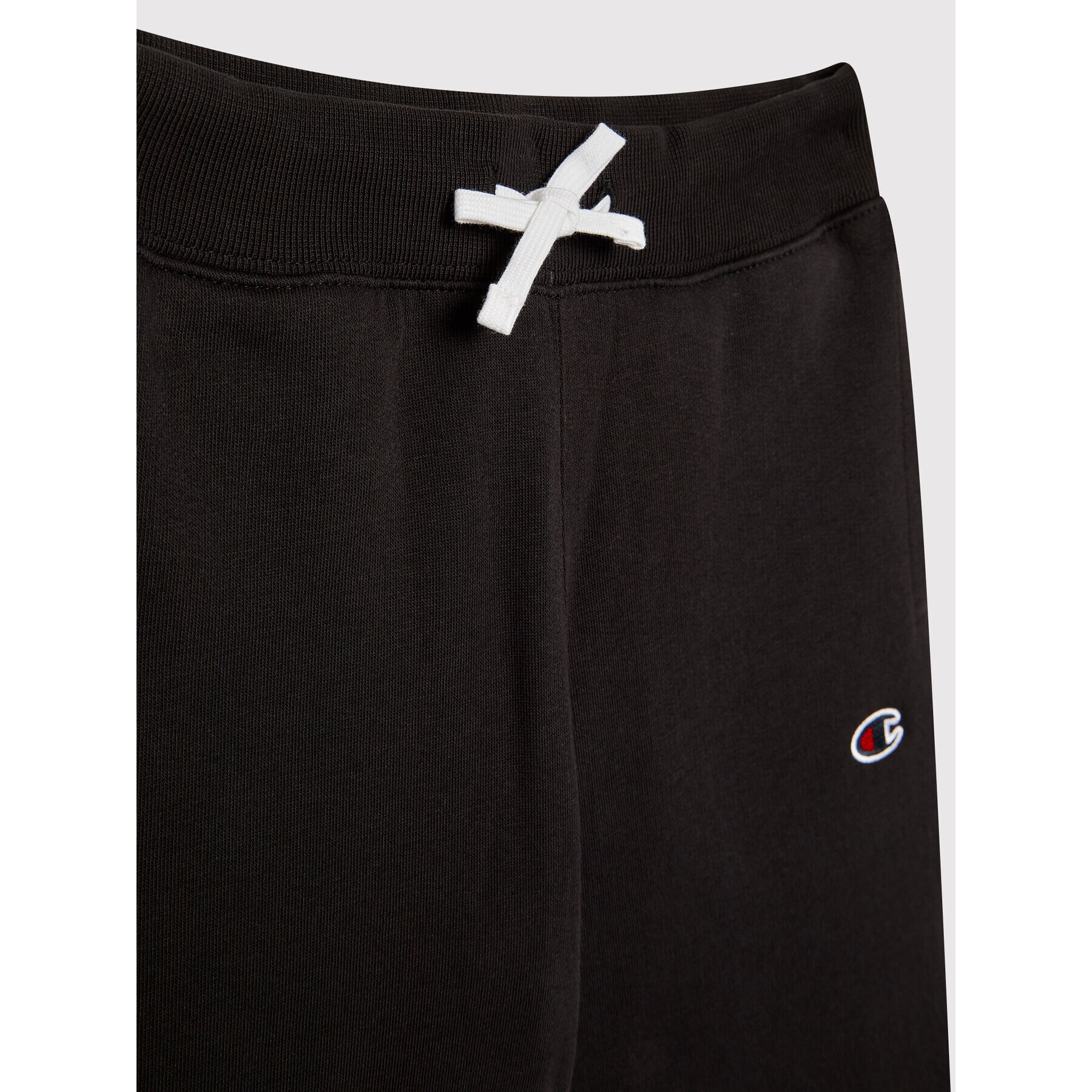Champion Долнище анцуг Asymmetric Colour Block 305782 Черен Regular Fit - Pepit.bg