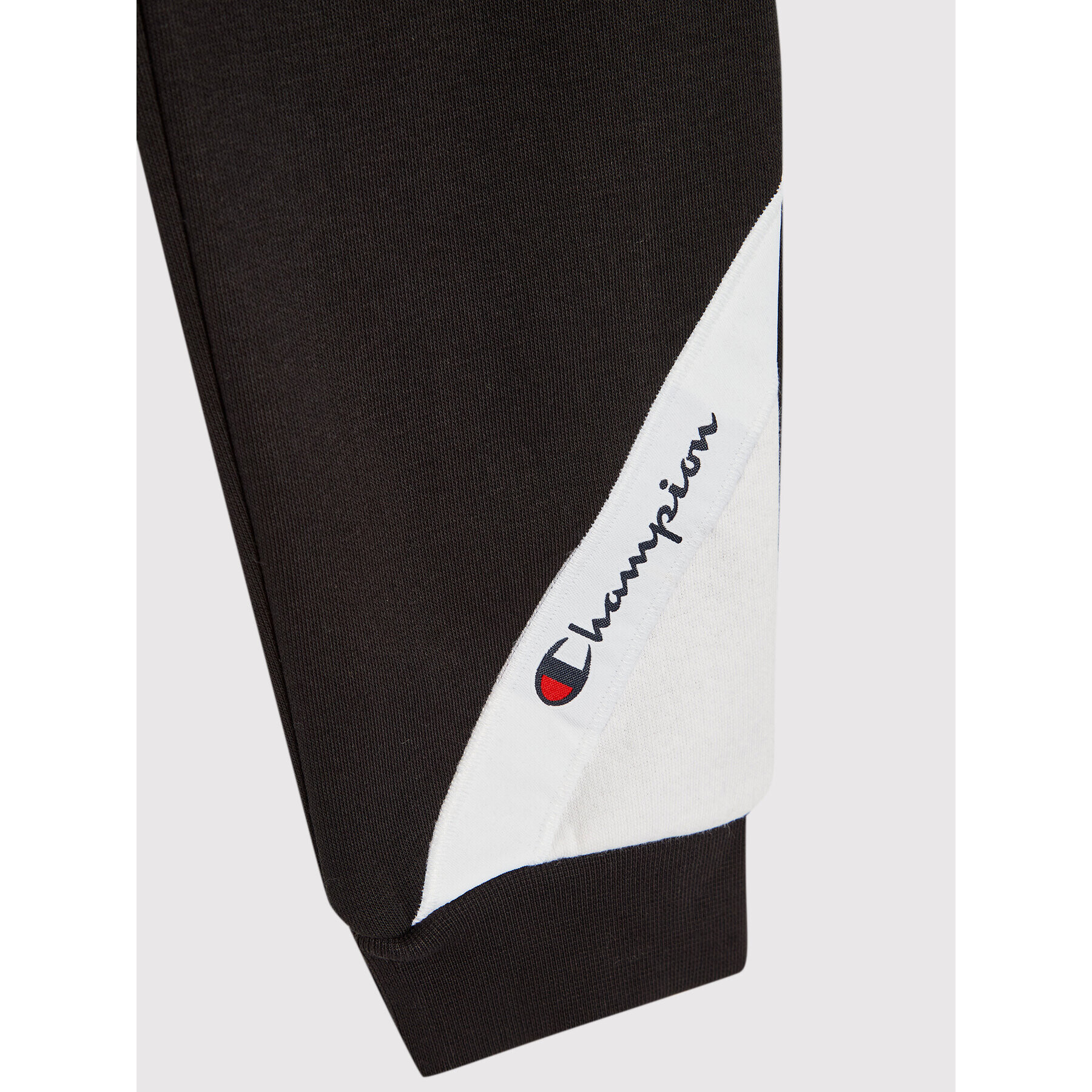 Champion Долнище анцуг Asymmetric Colour Block 305782 Черен Regular Fit - Pepit.bg