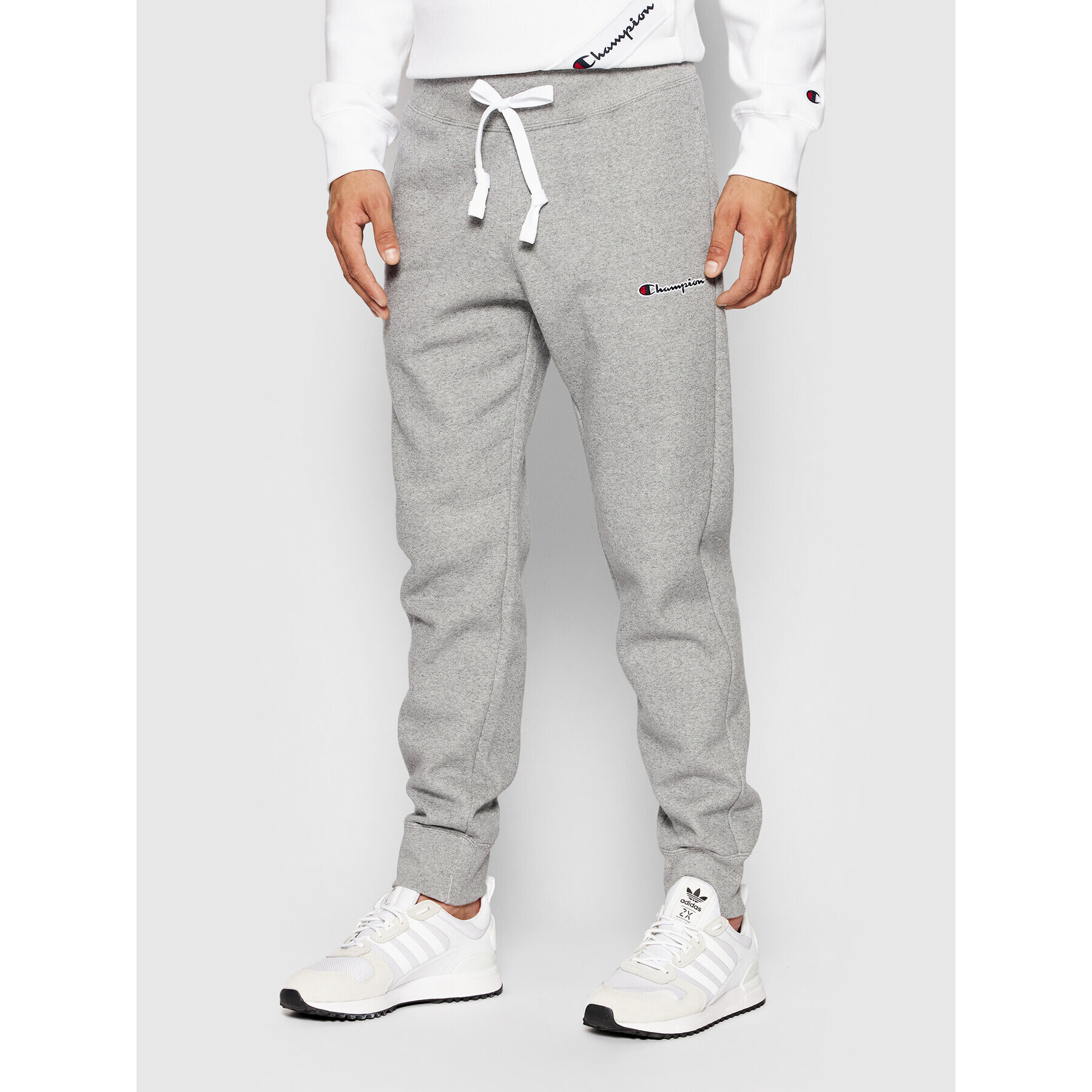 Champion Долнище анцуг Blend Small Script Logo 216479 Сив Regular Fit - Pepit.bg