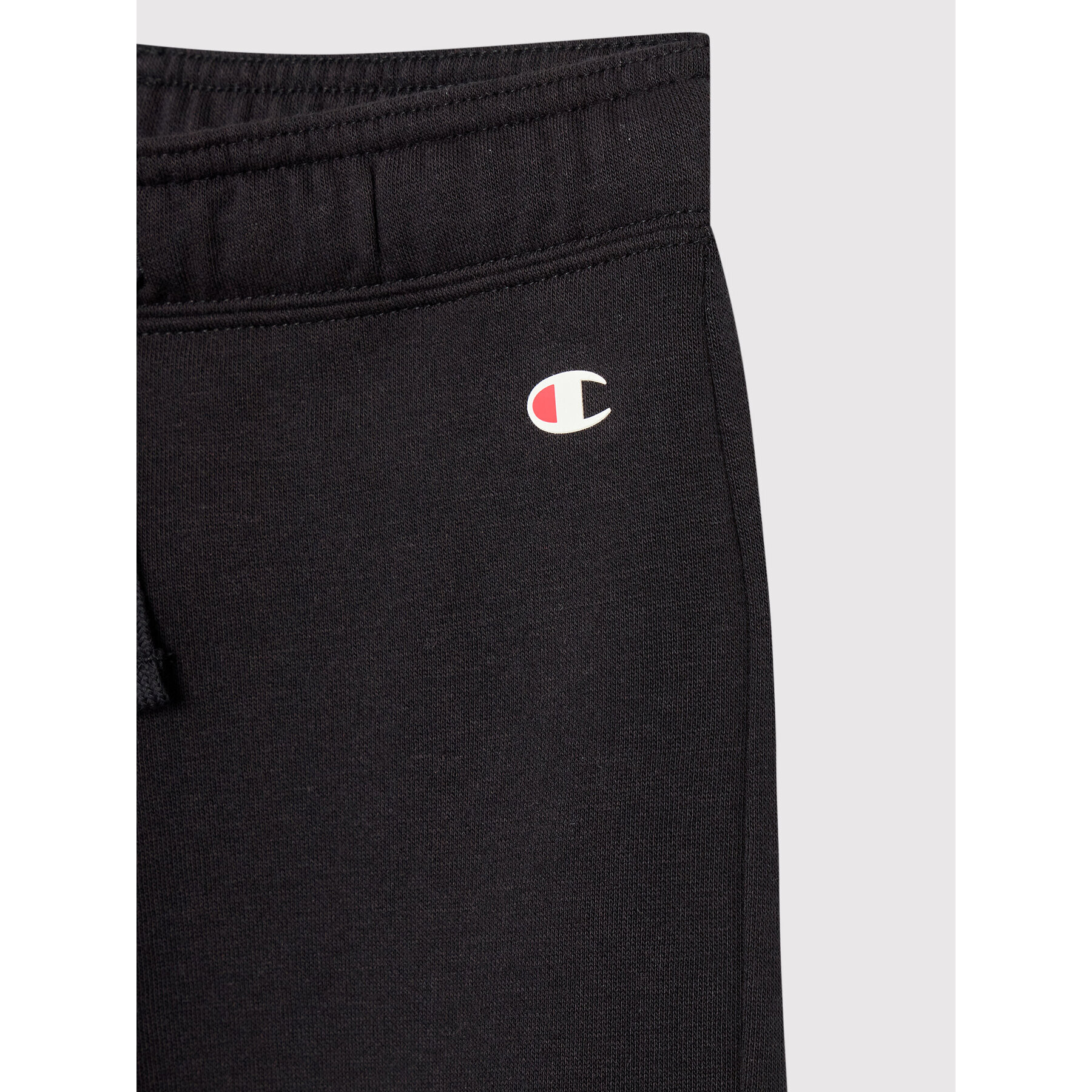 Champion Долнище анцуг Logo Stretch 404451 Черен Regular Fit - Pepit.bg