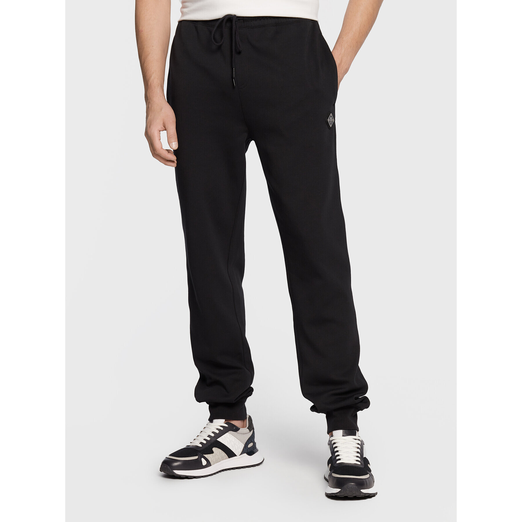 J.Lindeberg Долнище анцуг Creed FMJS0651 Черен Relaxed Fit - Pepit.bg