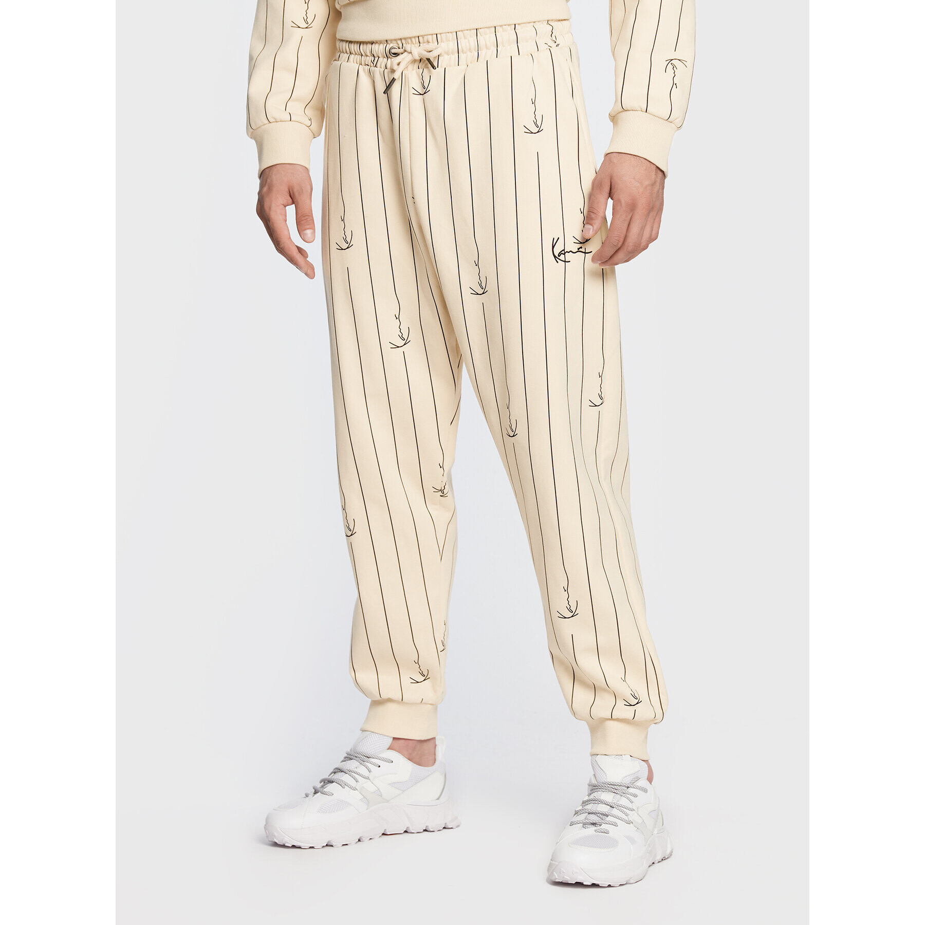 Karl Kani Долнище анцуг Small Signature Logo Pinstripe 6004670 Бежов Relaxed Fit - Pepit.bg