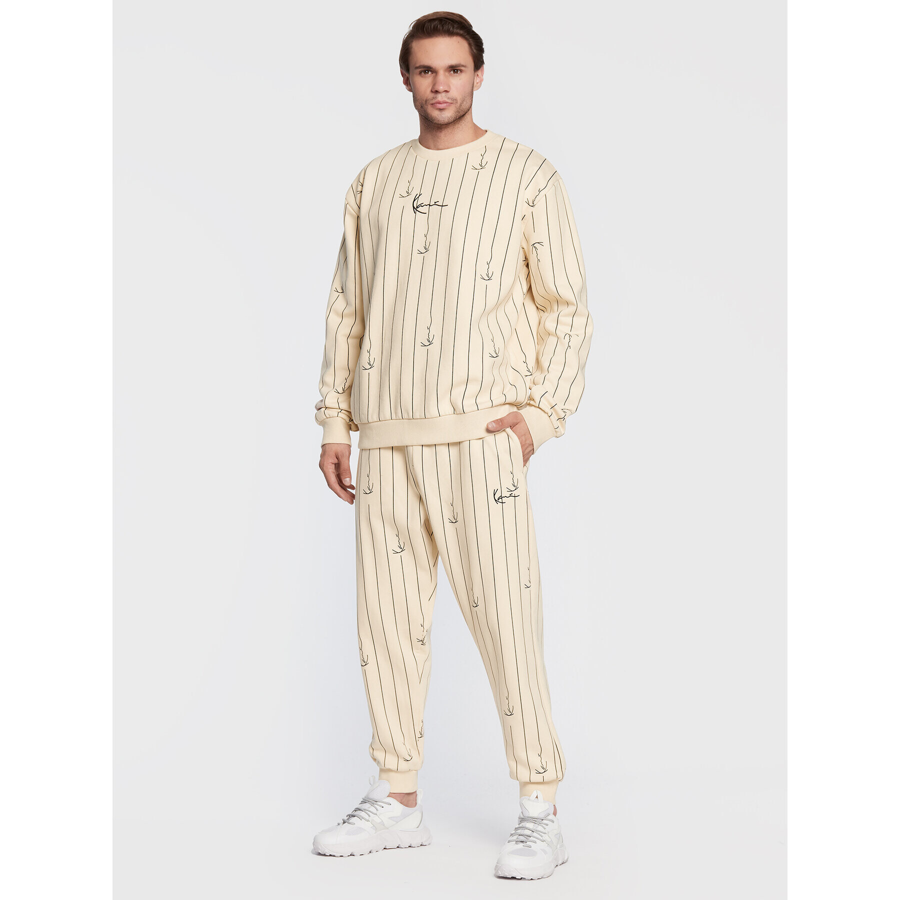 Karl Kani Долнище анцуг Small Signature Logo Pinstripe 6004670 Бежов Relaxed Fit - Pepit.bg