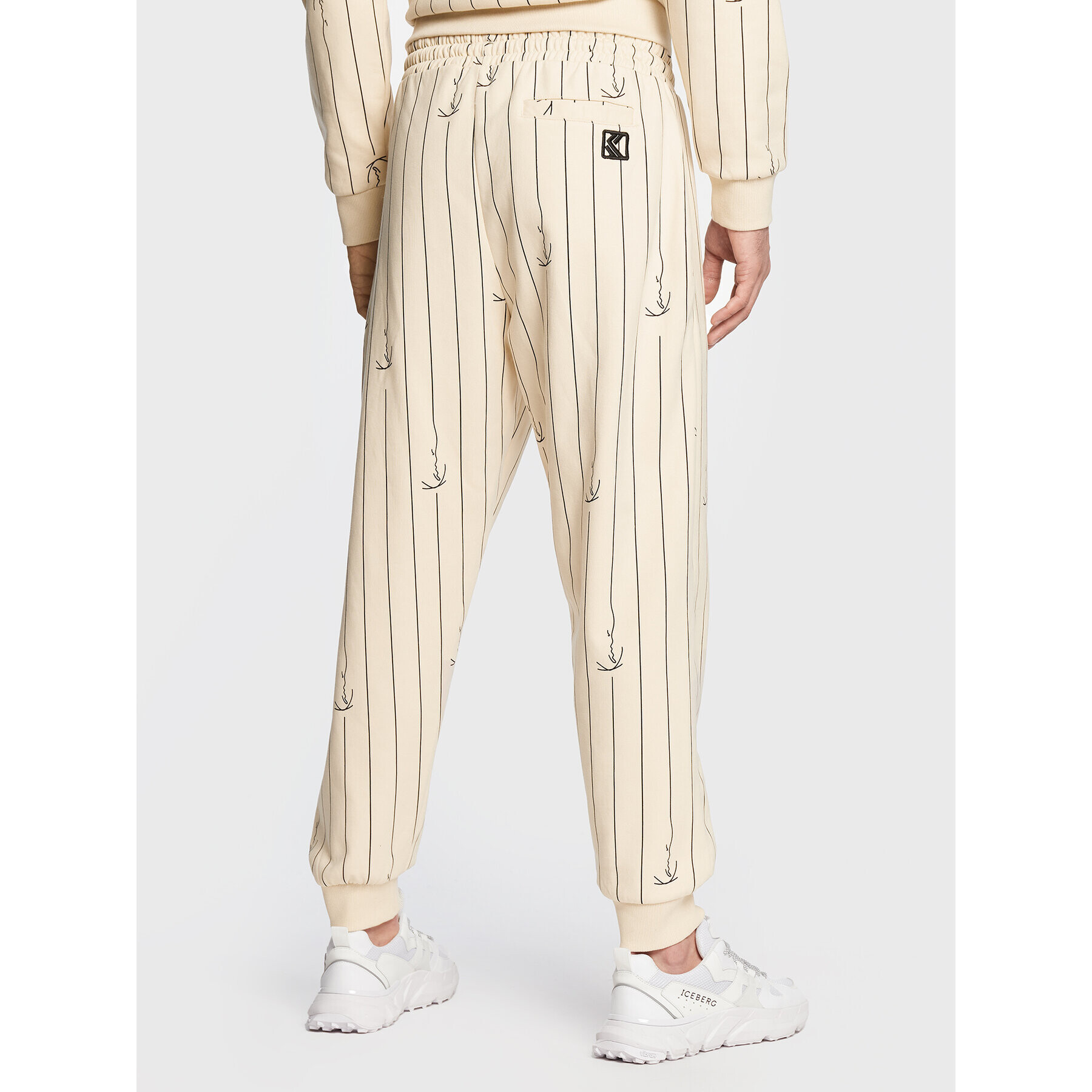 Karl Kani Долнище анцуг Small Signature Logo Pinstripe 6004670 Бежов Relaxed Fit - Pepit.bg