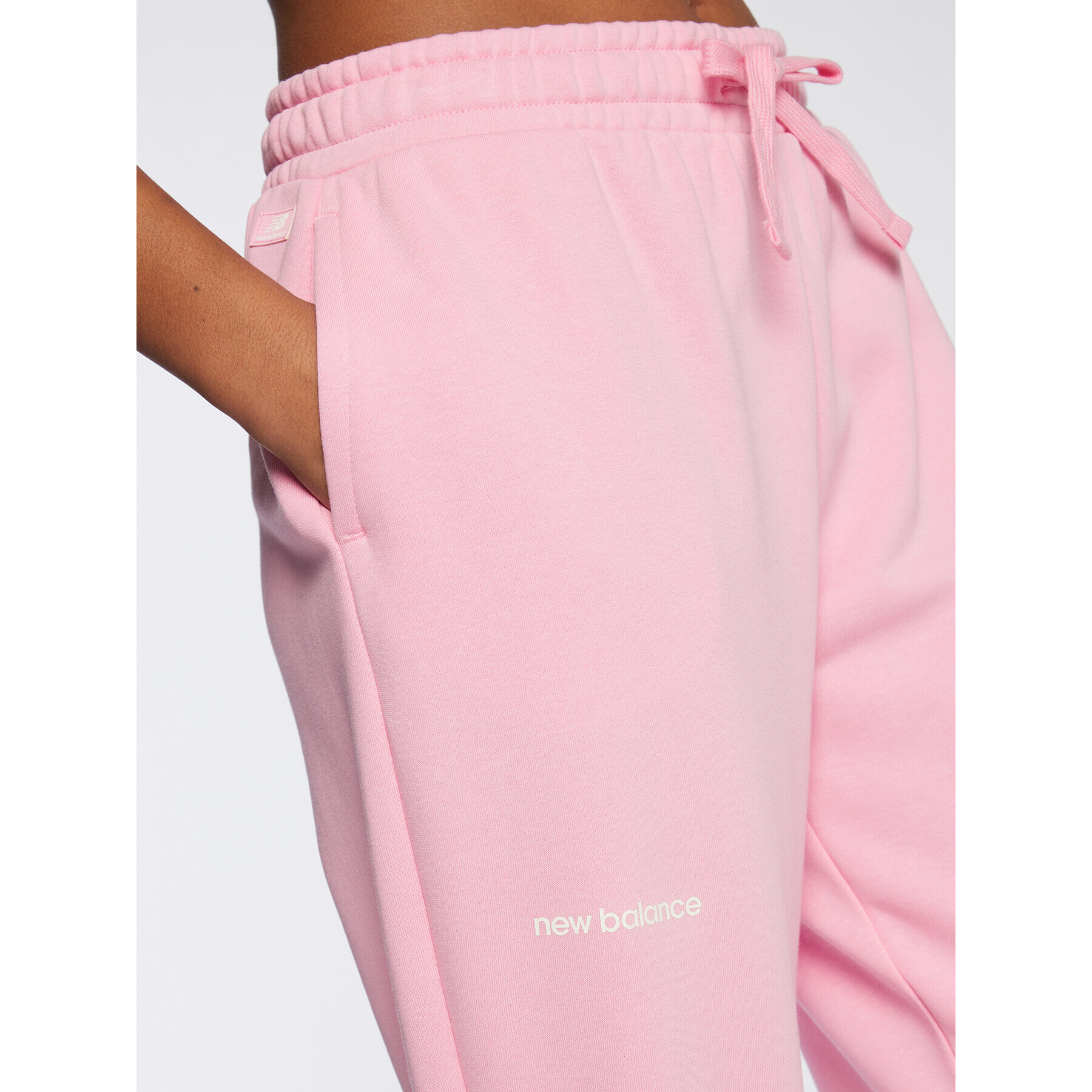 New Balance Долнище анцуг Essentials WP23508 Розов Relaxed Fit - Pepit.bg