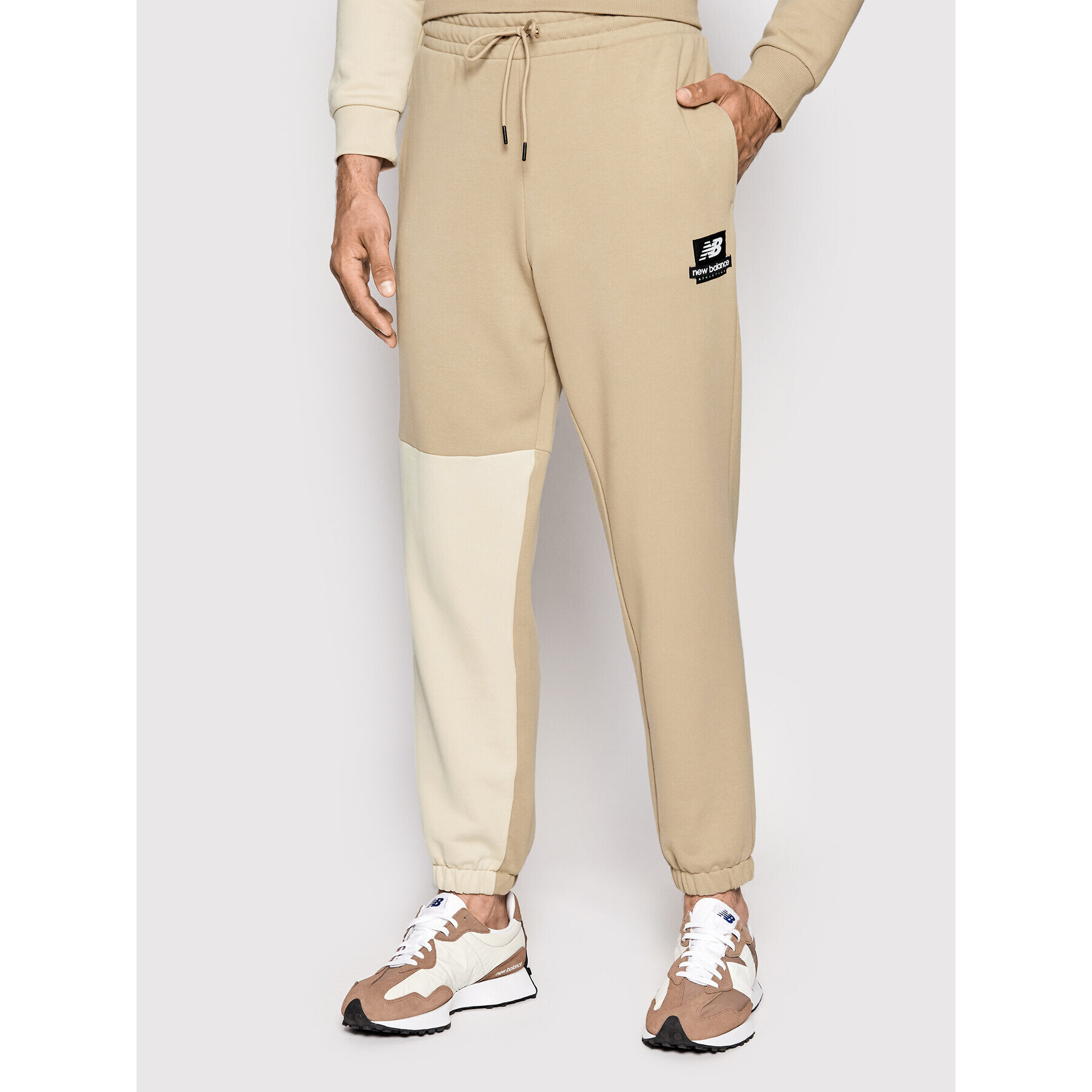 New Balance Долнище анцуг MP21550 Бежов Regular Fit - Pepit.bg