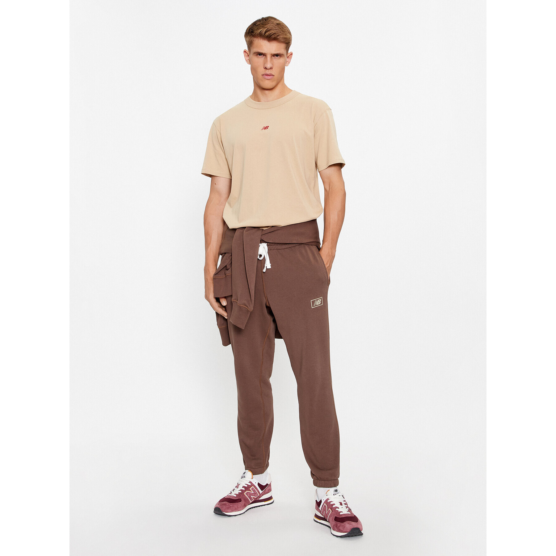 New Balance Долнище анцуг NB Essentials Sweatpant MP33509 Кафяв Regular Fit - Pepit.bg