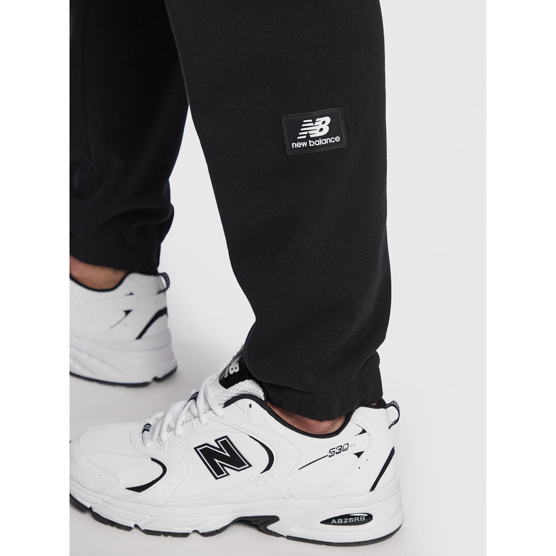 New Balance Долнище анцуг Unisex NBUP235 Черен Oversize - Pepit.bg