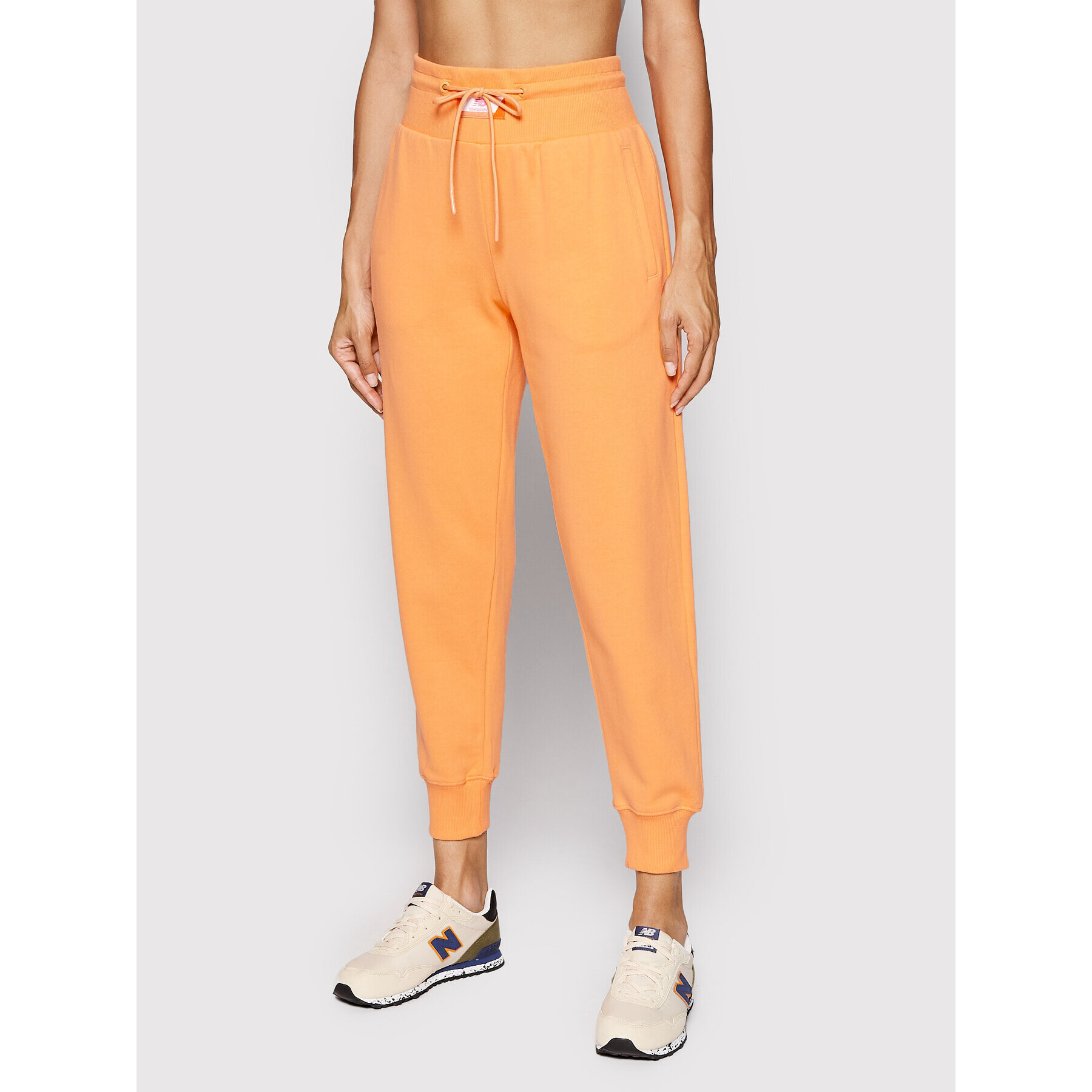 New Balance Долнище анцуг WP21503 Оранжев Relaxed Fit - Pepit.bg