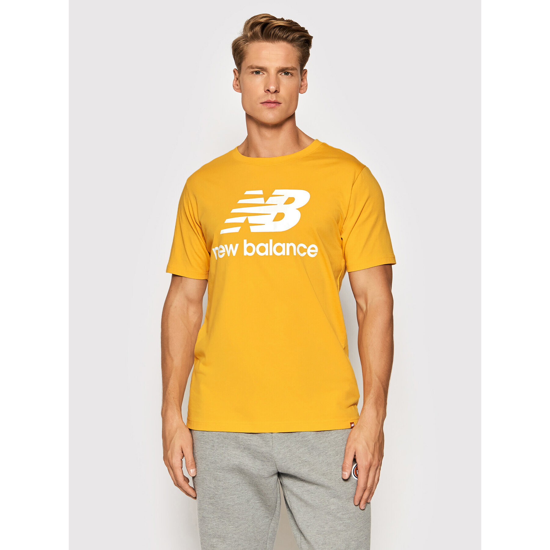 New Balance Тишърт Essential Logo MT01575 Жълт Athletic Fit - Pepit.bg