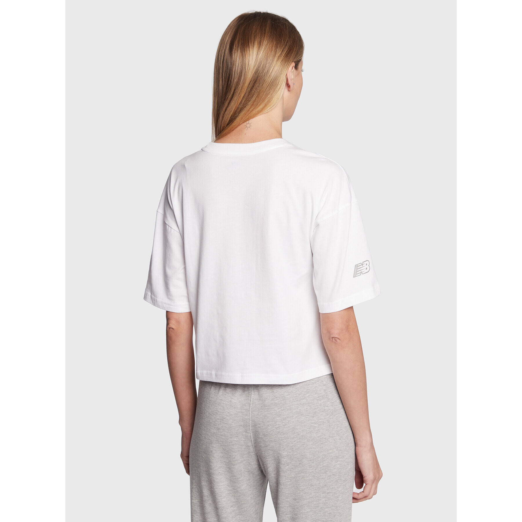 New Balance Тишърт Essentials Graphic WT23513 Бял Relaxed Fit - Pepit.bg
