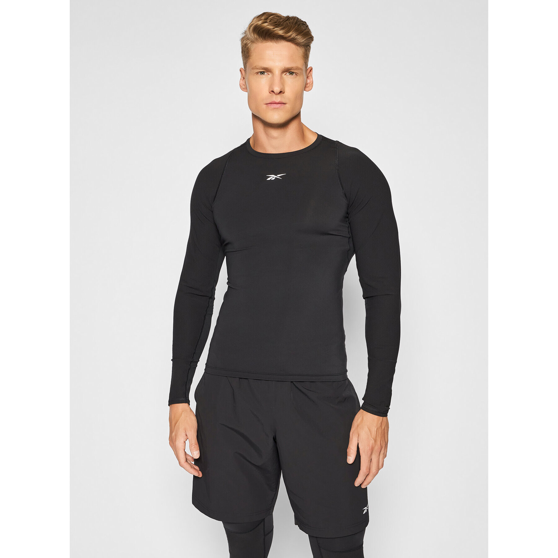 Reebok Тениска от техническо трико United By Fitness GT3225 Черен Compression Fit - Pepit.bg