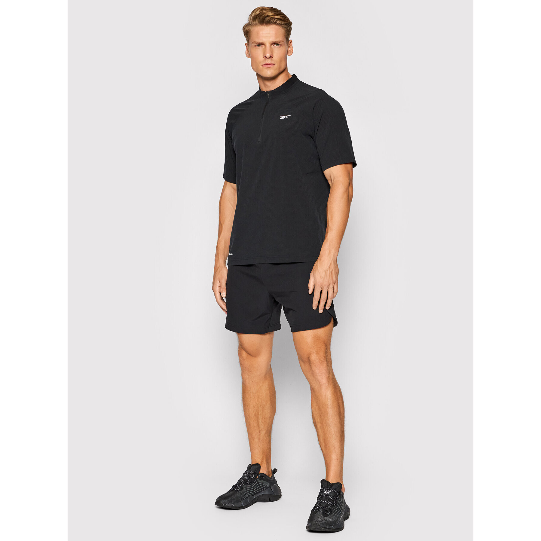 Reebok Тениска от техническо трико Les Mills H08977 Черен Slim Fit - Pepit.bg